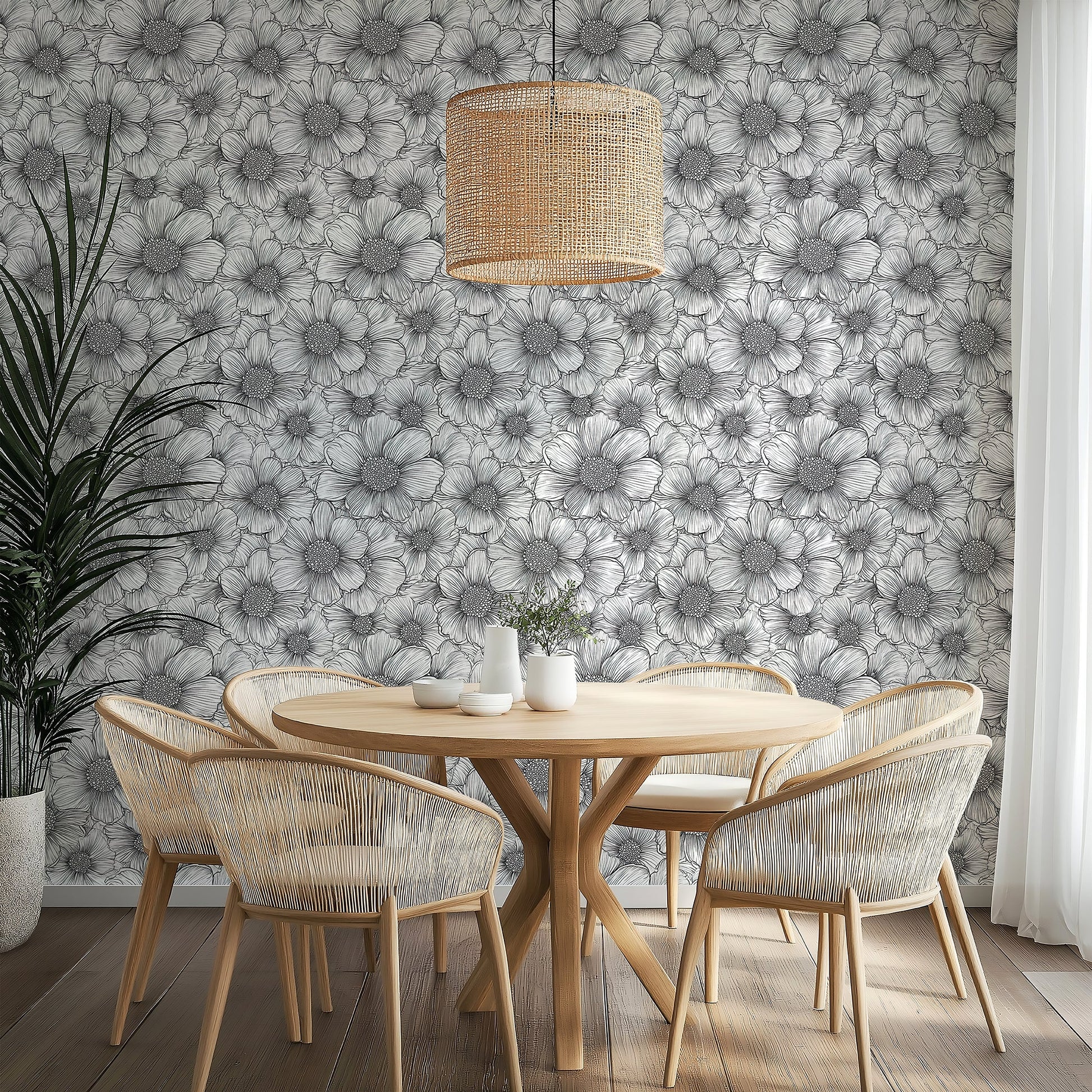 Elegant Petal Poetry wallpaper featuring black-and-white floral design in a modern dining area with woven chairs.