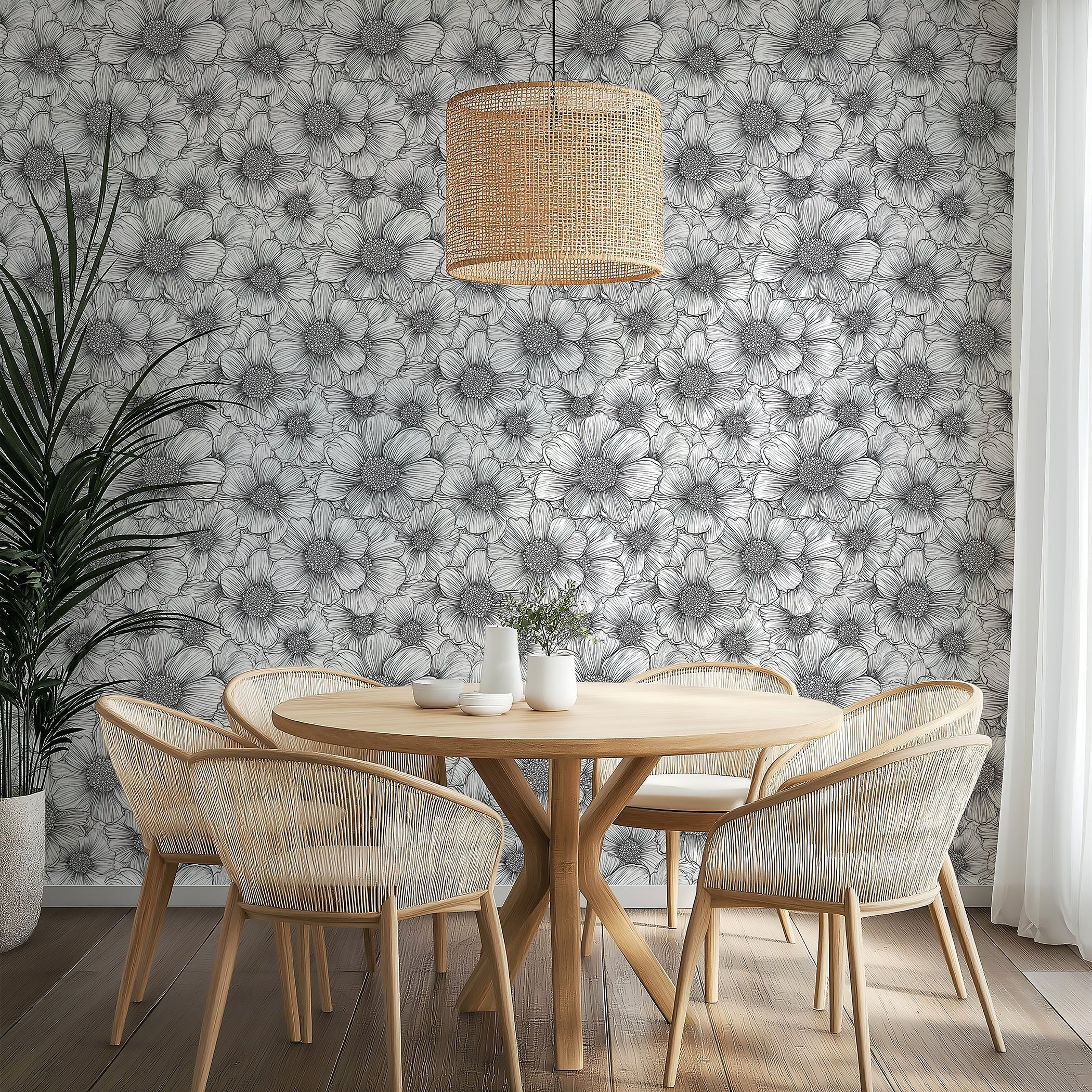 Elegant Petal Poetry wallpaper featuring black-and-white floral design in a modern dining area with woven chairs.