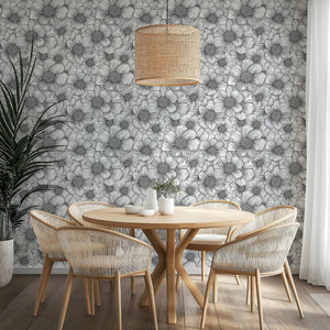 Elegant Petal Poetry wallpaper featuring black-and-white floral design in a modern dining area with woven chairs.