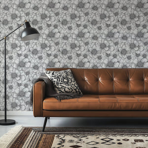 Sophisticated black and white floral wallpaper design featuring hand-drawn flowers, enhancing a modern living space.