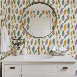 Feather Fantasy wallpaper featuring vibrant peacock feathers in mustard, emerald, violet, and soft taupe colors in a bathroom.