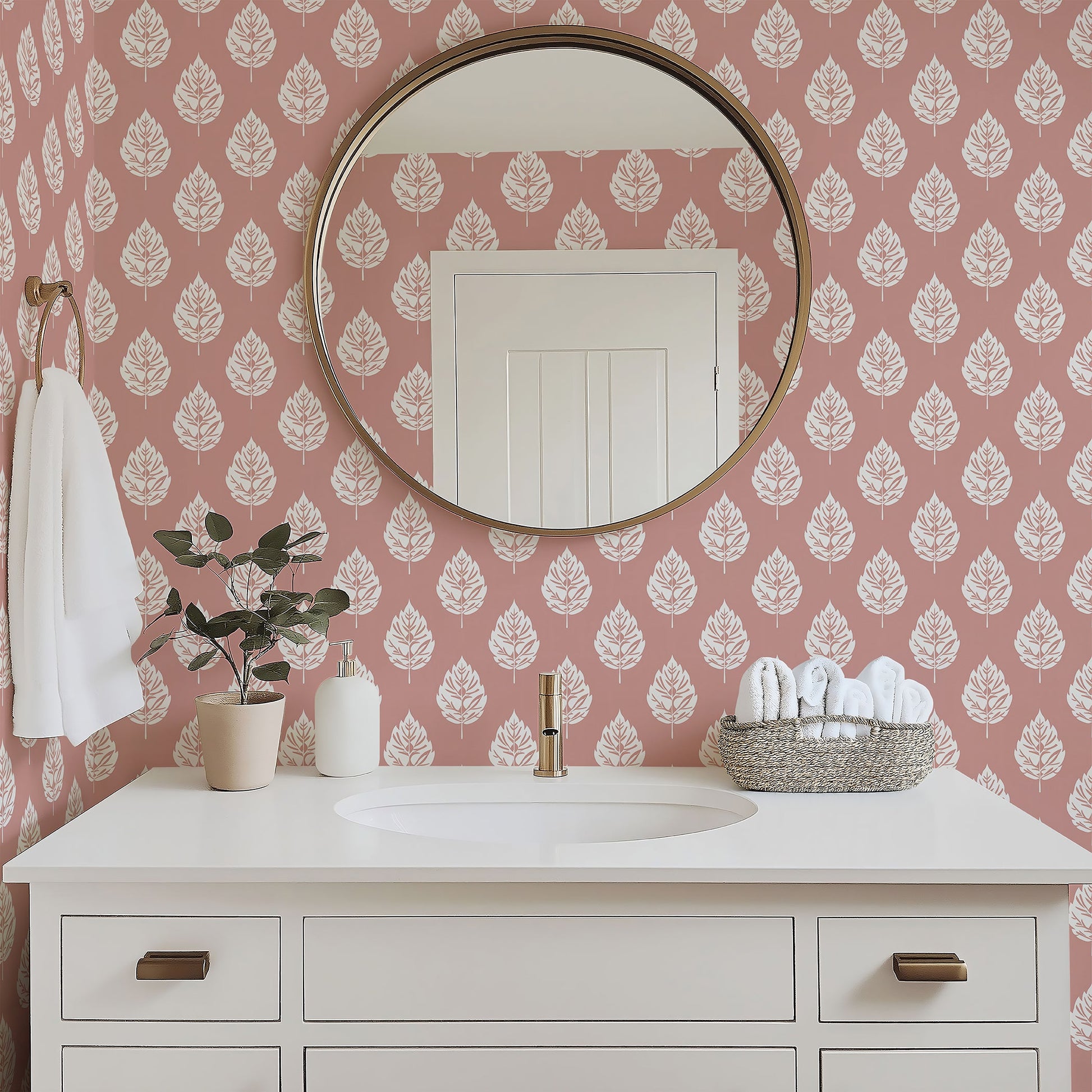 Blush Leaf wallpaper featuring white leaf patterns on a pink background, enhancing a stylish bathroom decor.