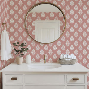 Blush Leaf wallpaper featuring white leaf patterns on a pink background, enhancing a stylish bathroom decor.