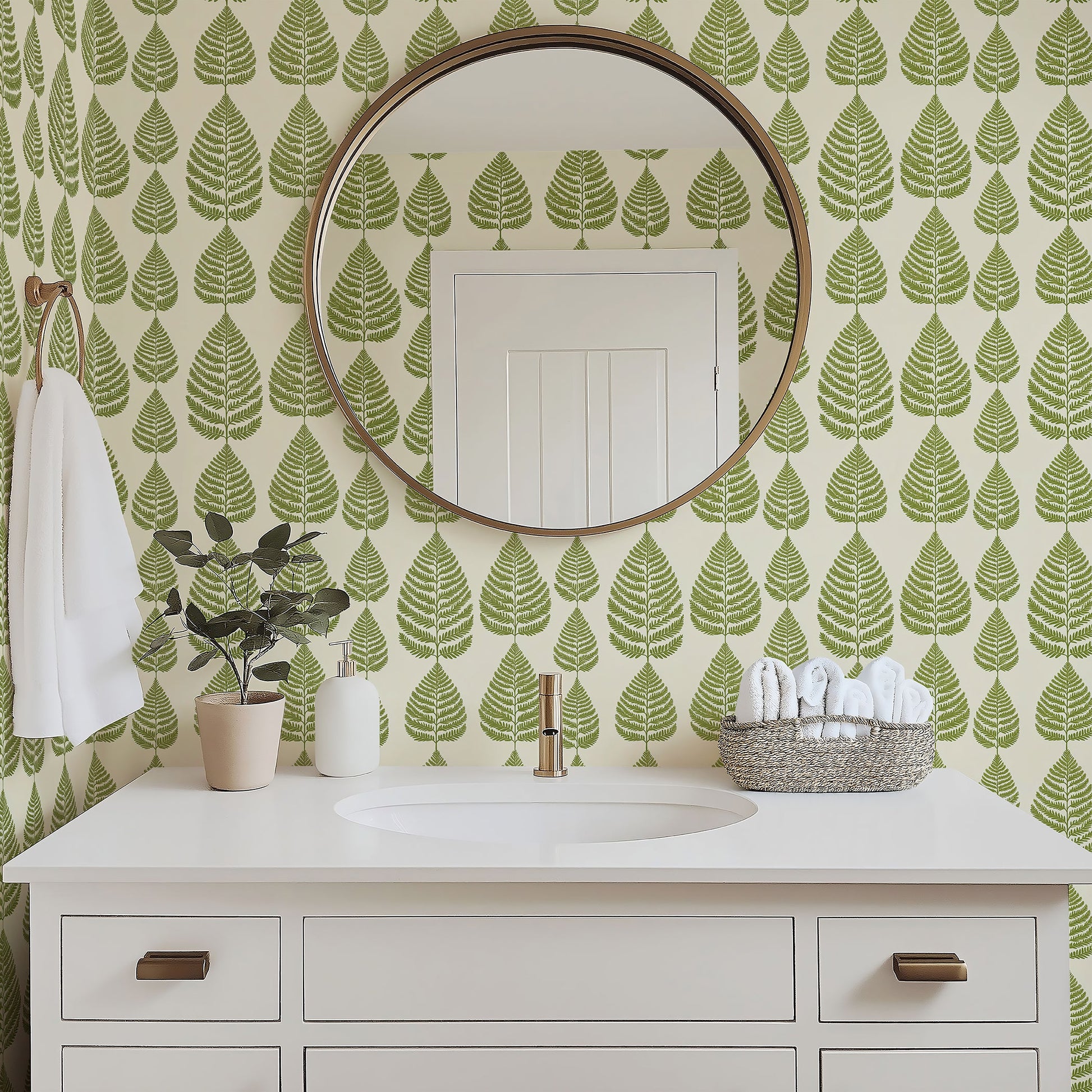 Fernwood Forest wallpaper featuring green foliage in a modern bathroom with circular mirror and white vanity.