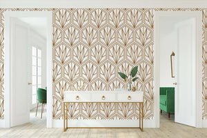 Art Deco geometric wallpaper with bronze hexagonal patterns on cream background in elegant modern room.