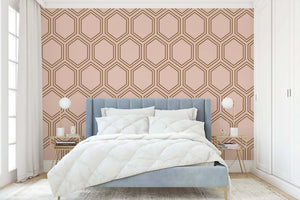 Art Deco Honeycomb Luxe wallpaper in bronze on blush background, enhancing modern bedroom with geometric elegance.