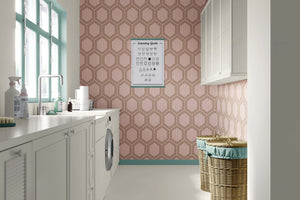 Honeycomb Luxe wallpaper with art deco geometric design in bronze and blush tones, enhancing modern interior elegance.
