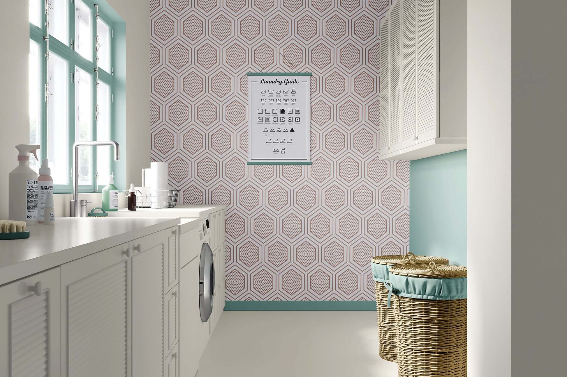 Art deco rose gold prism geometric wallpaper in a modern laundry room with white cabinets and wicker baskets.