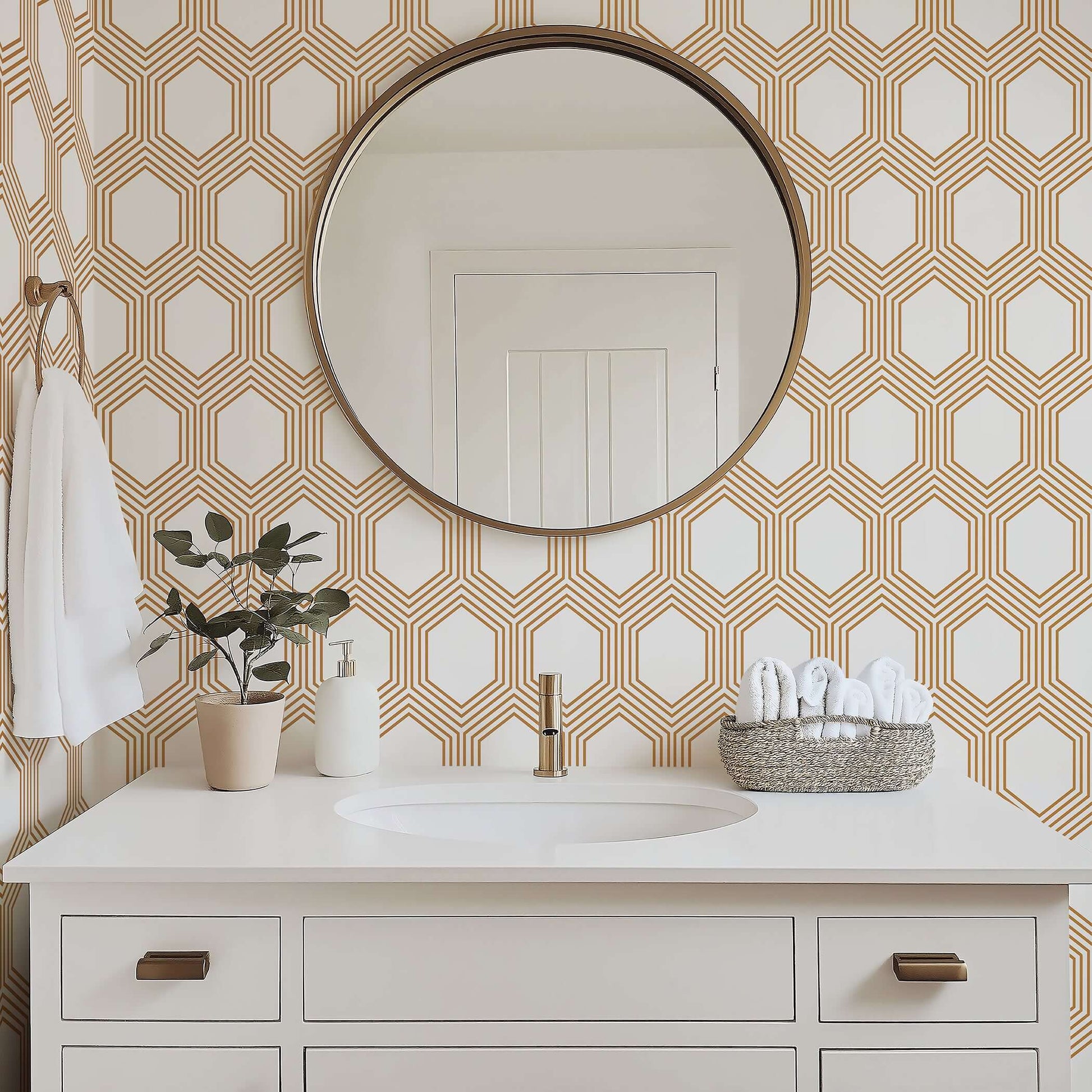Art Deco geometric wallpaper with bronze hexagons on white in a modern bathroom setting.