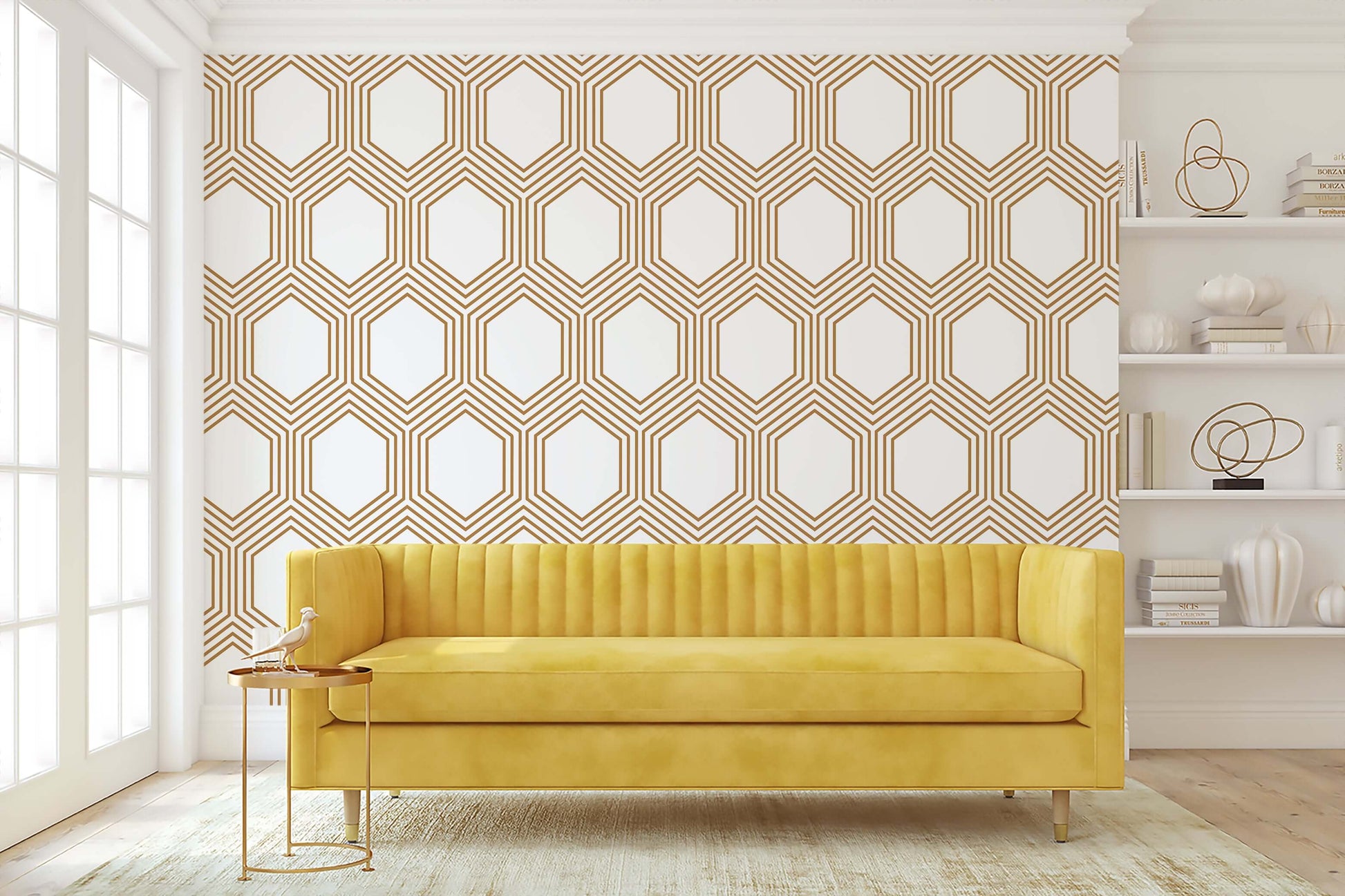 Art Deco geometric wallpaper with bronze hexagonal pattern on white, enhancing a modern living room with a yellow sofa.