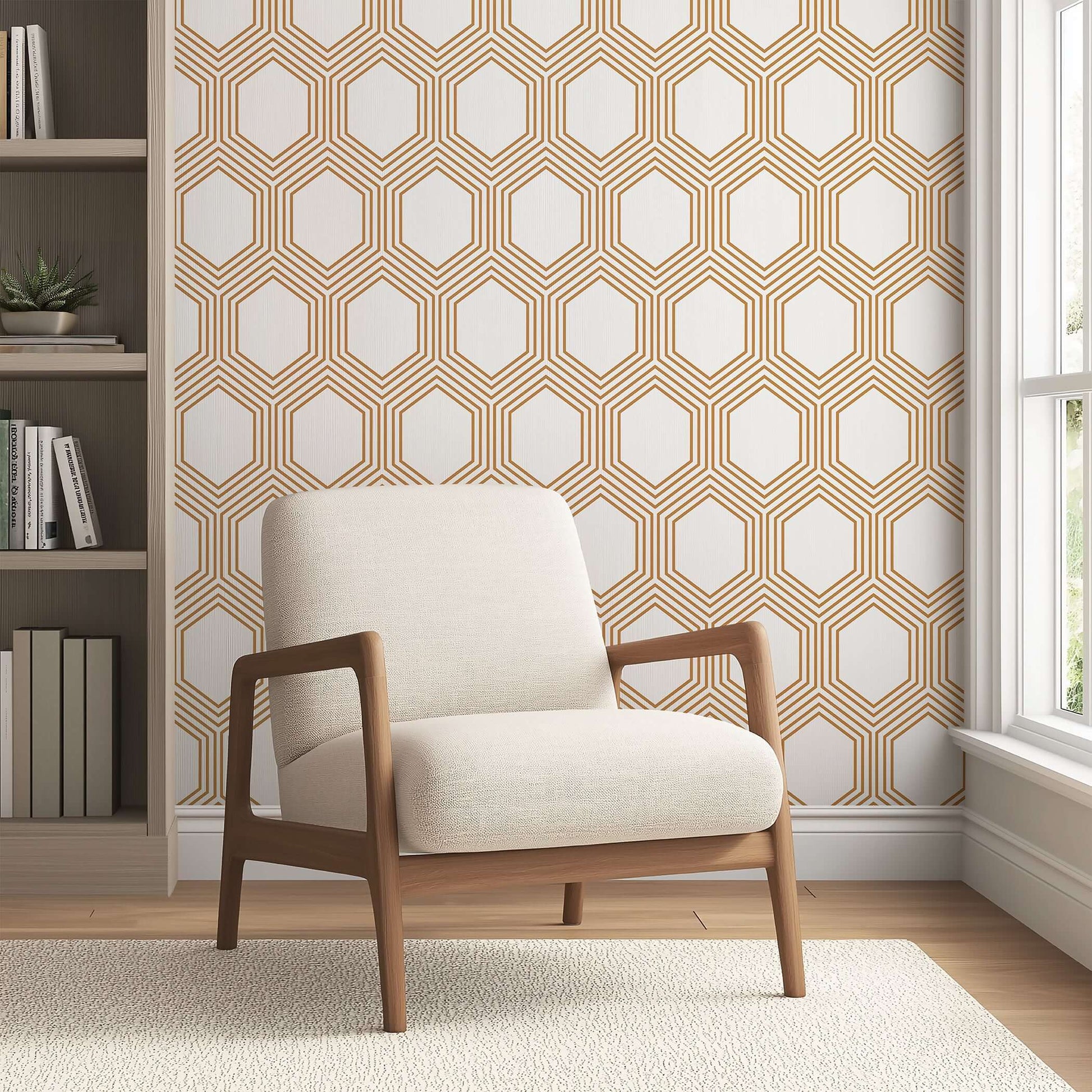 Art Deco geometric wallpaper with bronze hexagons on white background, complementing a modern living room with a beige armchair.