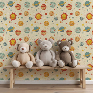 Cosmic Smiles wallpaper with playful planets and suns, perfect for a nursery or playroom, featuring teddy bears on a bench.