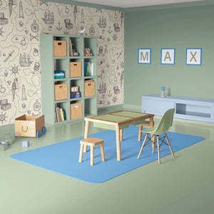 Children's room featuring nautical treasure map wallpaper with hand-drawn pirate ships, perfect coastal theme for playrooms or nurseries.