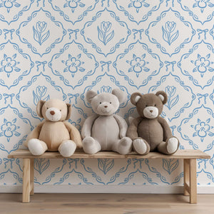 Playroom with plush teddy bears on a bench against 'Little Dutch Delight' wallpaper featuring blue tulips, perfect for a French cottage style.