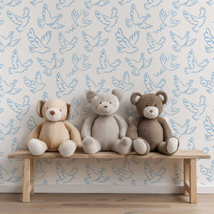 Teddy bears on bench with blue dove wallpaper, perfect for children's nursery or playroom, featuring modern design in blue and white.