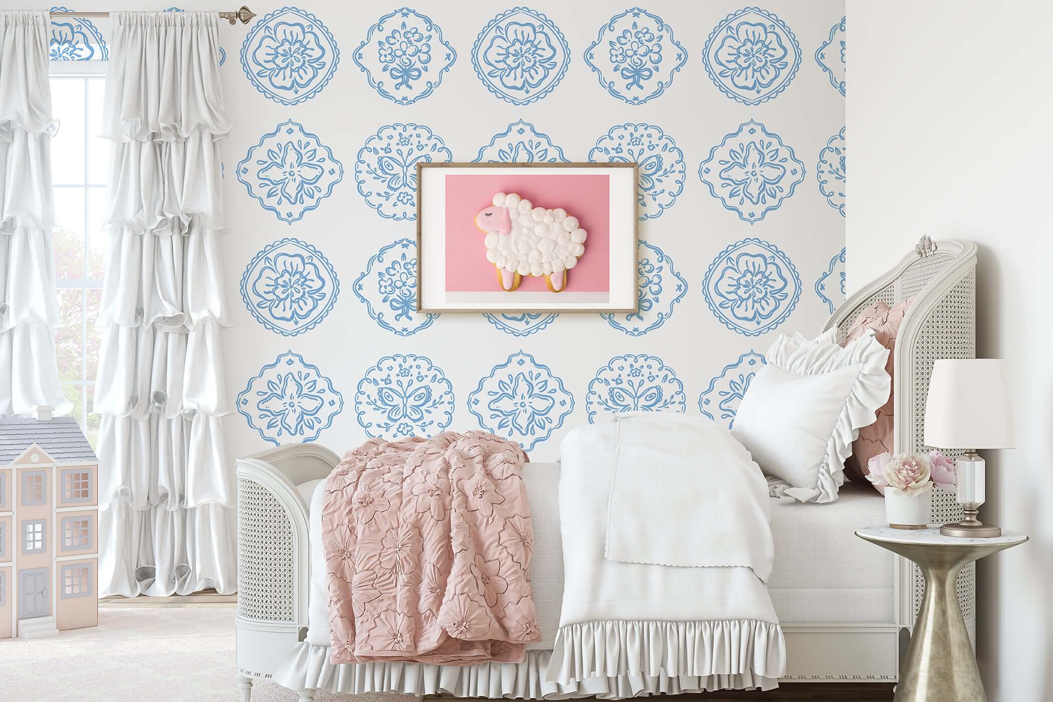 Elegant nursery with Chateau Garden wallpaper featuring blue floral medallions, blending French style with charm and sophistication.