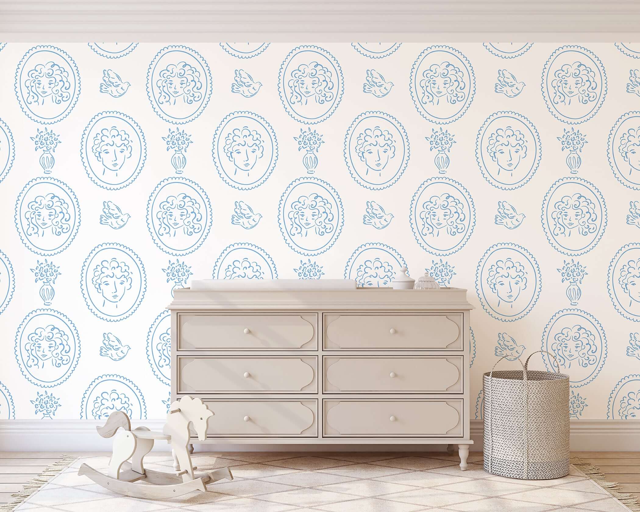 Charming blue and white French-inspired wallpaper with curly-haired portraits, birds, florals, and vases in a modern setting.