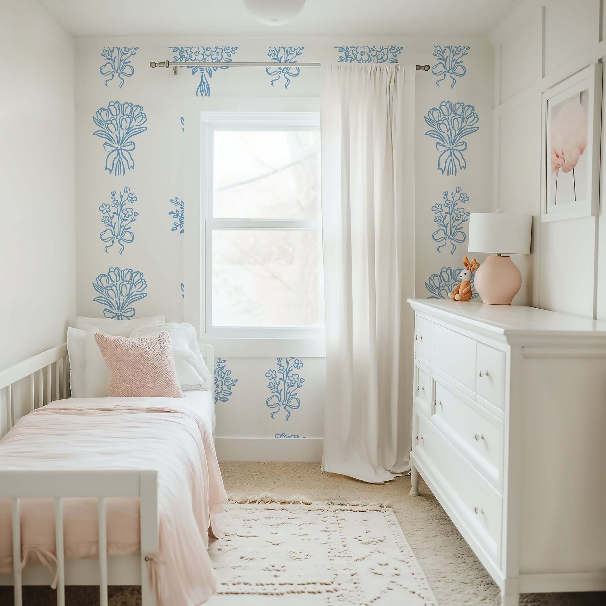 Elegant nursery with Blue Ink Botanicals wallpaper featuring soft blue floral patterns on white, perfect for cottage design or timeless style.