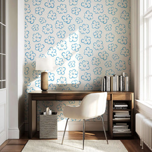 Abstract blue and white floral wallpaper in a modern room, featuring minimalist hand-drawn flowers on a light backdrop for a whimsical touch.