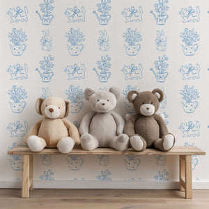 Enchanting bow-tied kitten wallpaper with flowers, teapots, and plush toys in a modern contemporary nursery setting.
