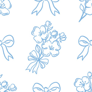 Delicate blue ribbon and flower pattern on white wallpaper, ideal for that French romantic vibe in any room.