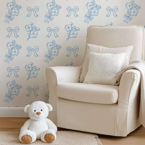 Elegant blue and white floral wallpaper with ribbons in cozy nursery, perfect for adding French charm and sophistication.