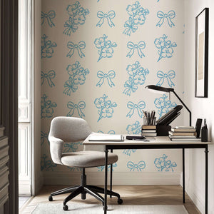 Elegant French wallpaper with blue hand-drawn floral sprigs and ribbons on white background, perfect for romantic, charming spaces.
