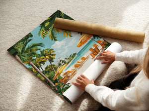 A person rolling out a vibrant tropical beach art print featuring palm trees and lounge chairs.