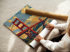Person unrolling a vintage travel poster of the Golden Gate Bridge at sunset, showcasing San Francisco wall art.