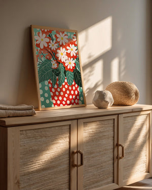 Colorful Bohemian art print featuring red-orange blooms in a polka-dotted vase on a turquoise background.