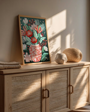 Charming Botanical Glow wall art print featuring a coral vase with white flowers on a deep teal background, perfect for Bohemian decor.