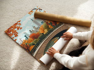 Person unrolling a vintage travel poster of Central Park in autumn with colorful leaves and Manhattan skyline.