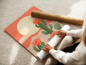 Sunrise Over Cactus Fields wall art print being unrolled, featuring cacti and flowers in a modern, bohemian style.