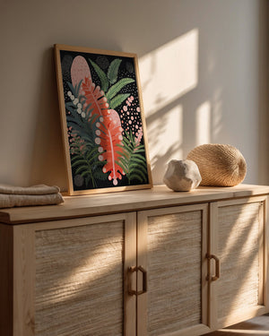 Abstract Jungle Glow wall art print featuring tropical leaves in a modern Bohemian style on a cabinet.
