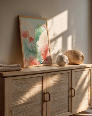 Boho Reef Harmony wall art print featuring ocean ferns in coral pinks and seafoam greens, displayed in a contemporary setting.