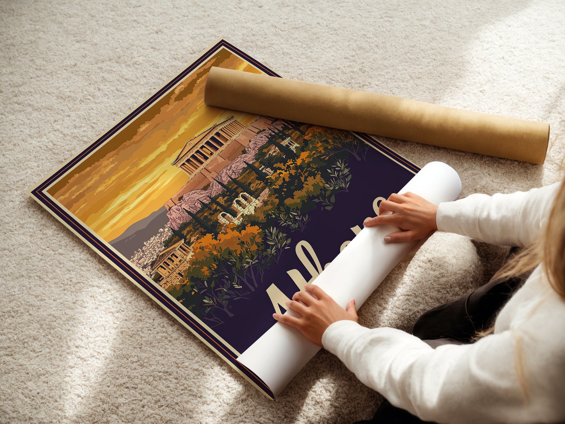 Person unrolling a vintage travel poster of the Parthenon in Athens, Greece at sunset, showcasing stunning landscape and architecture.