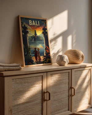 Vintage travel poster of Bali featuring a sunset, temple, and couple by tranquil waters, ideal wall art for decor.