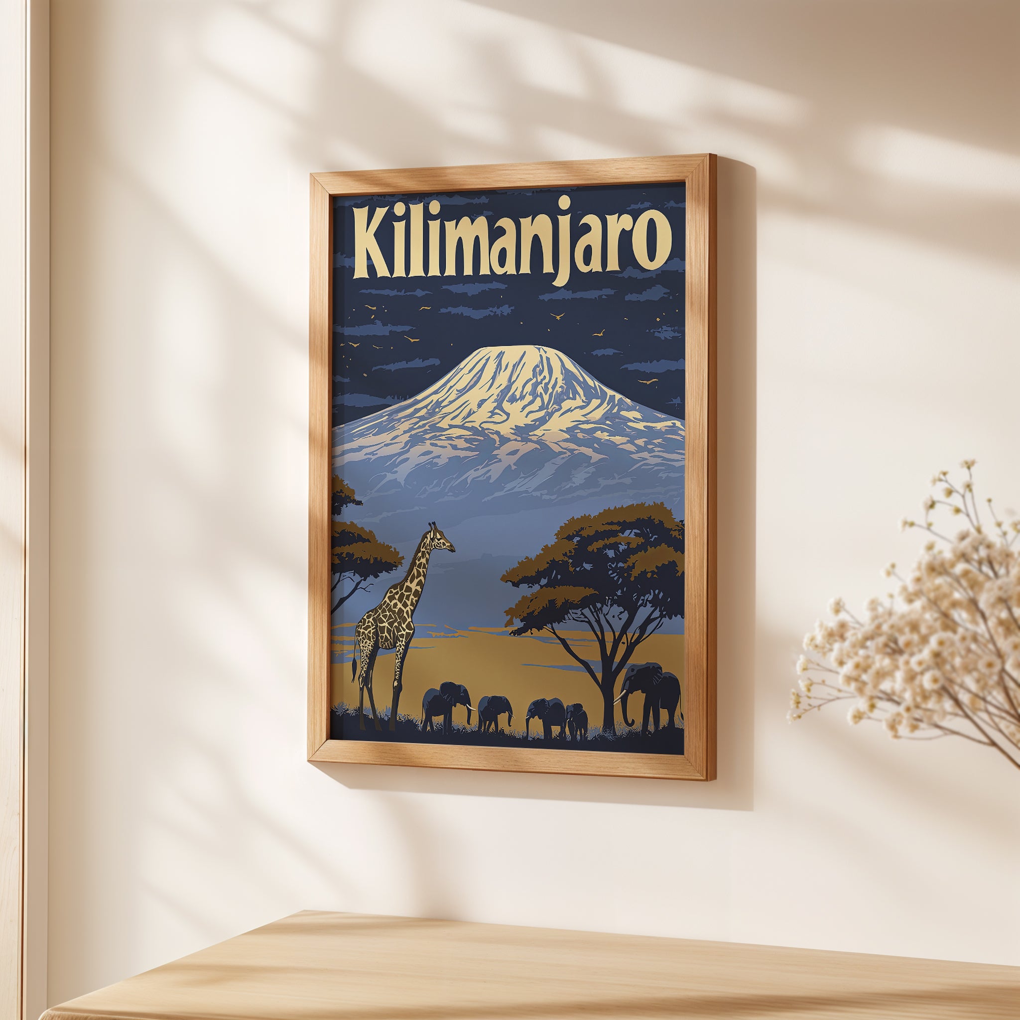 Vintage travel poster of Kilimanjaro with giraffes and elephants in silhouette against a dramatic sky.