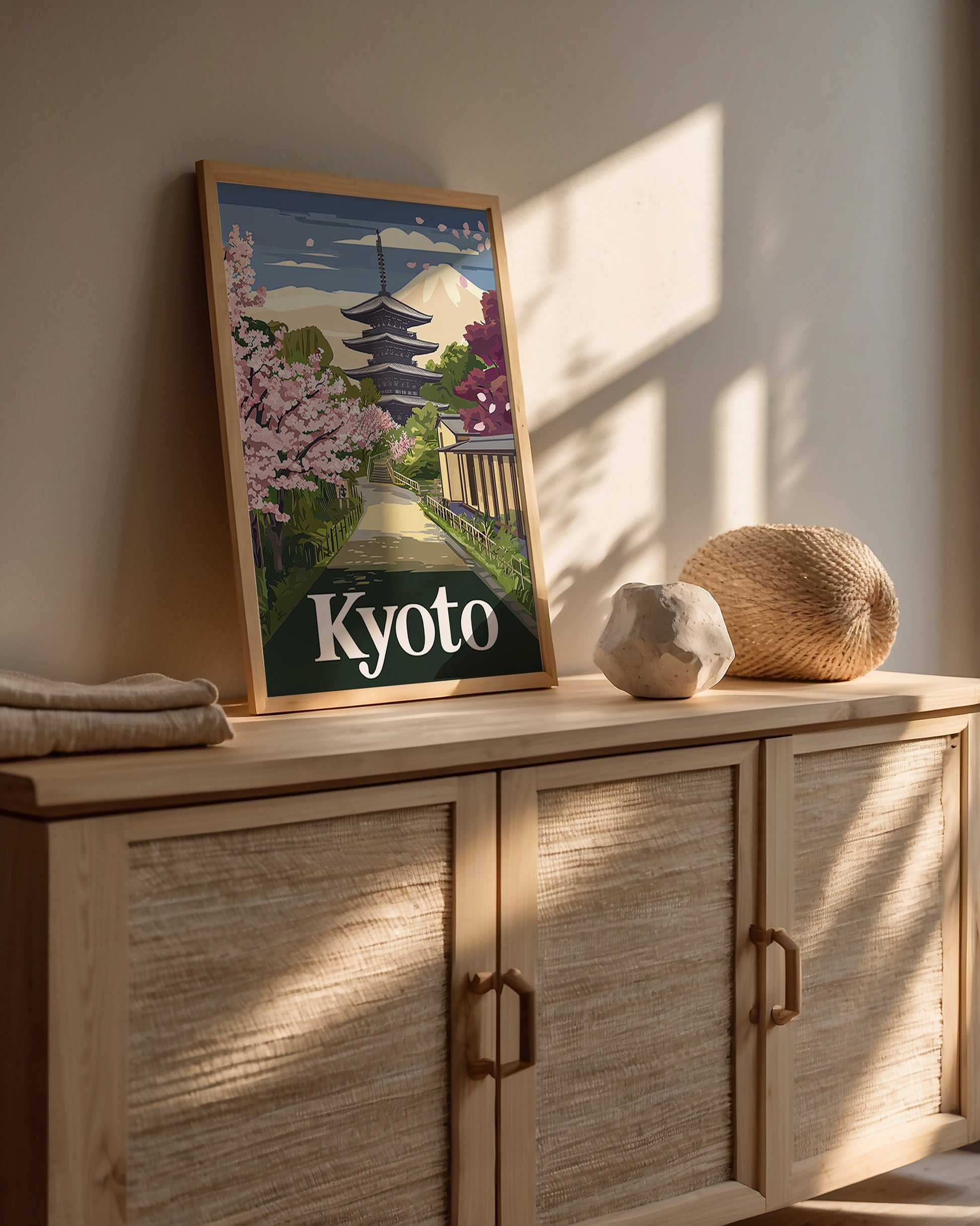 Vintage travel poster of Kyoto featuring cherry blossoms, a pagoda, and Mount Fuji, perfect wall art for travelers.