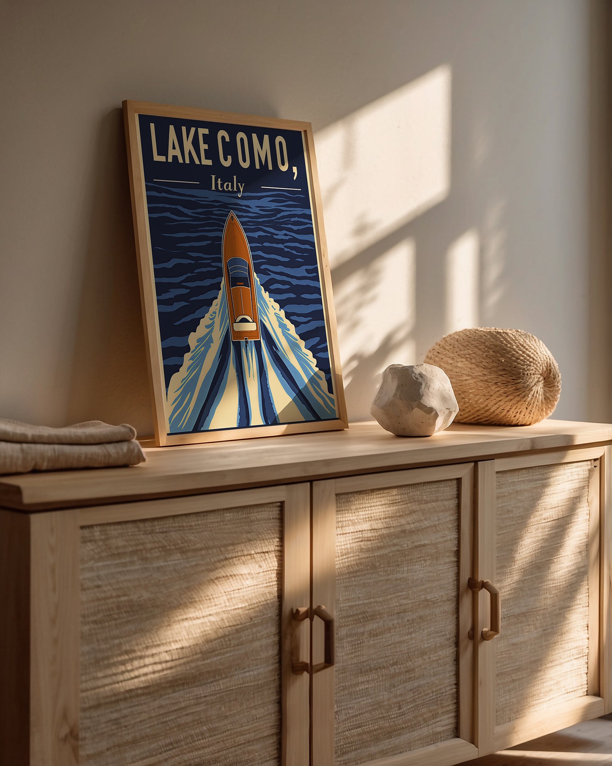 Vintage travel poster of Lake Como, Italy, featuring a classic boat on deep blue waters.
