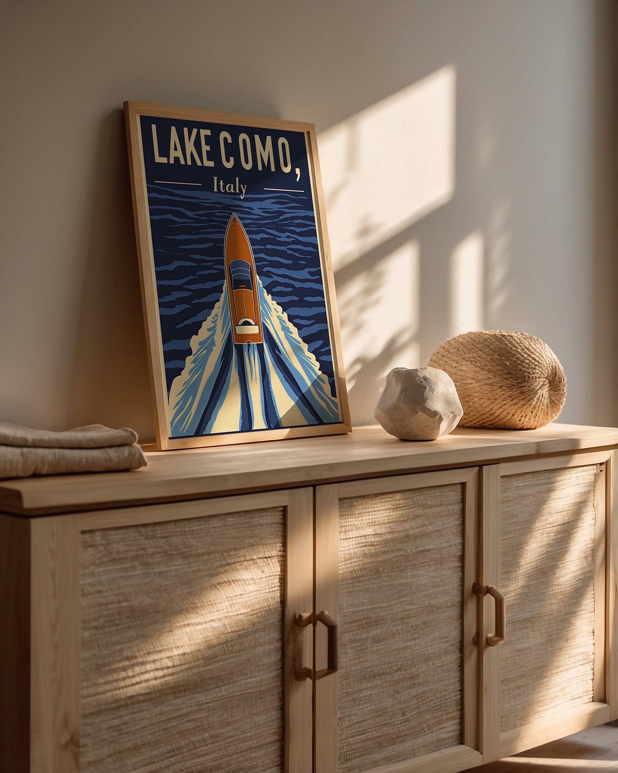 Vintage travel poster of Lake Como, Italy, featuring a classic boat on deep blue waters.