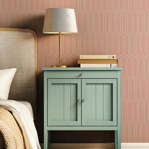 Pastel Moderne Lines wallpaper in a bedroom setting, featuring pink to create a retro art deco look with geometric vertical lines.