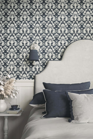 Elegant bedroom with floral damask vintage design wallpaper and chic blue and gray decor, showcasing timeless baroque artistry.