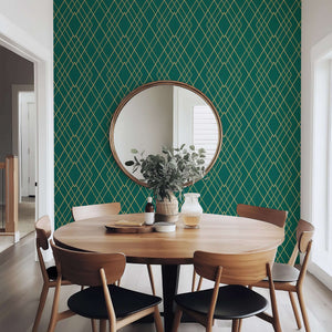 Art Deco geometric green and gold wallpaper in a dining room setting, featuring a round mirror and modern wooden furniture.