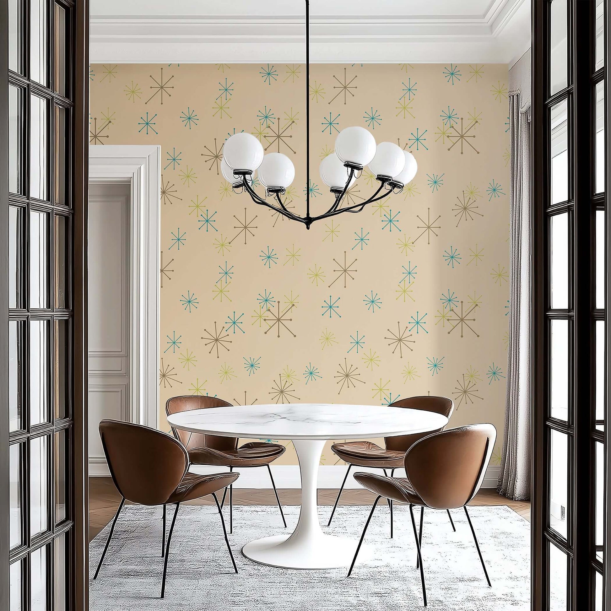 Modern dining room with Atomic Burst Fiesta mid-century wallpaper featuring teal, lime, and mocha starbursts on beige background.