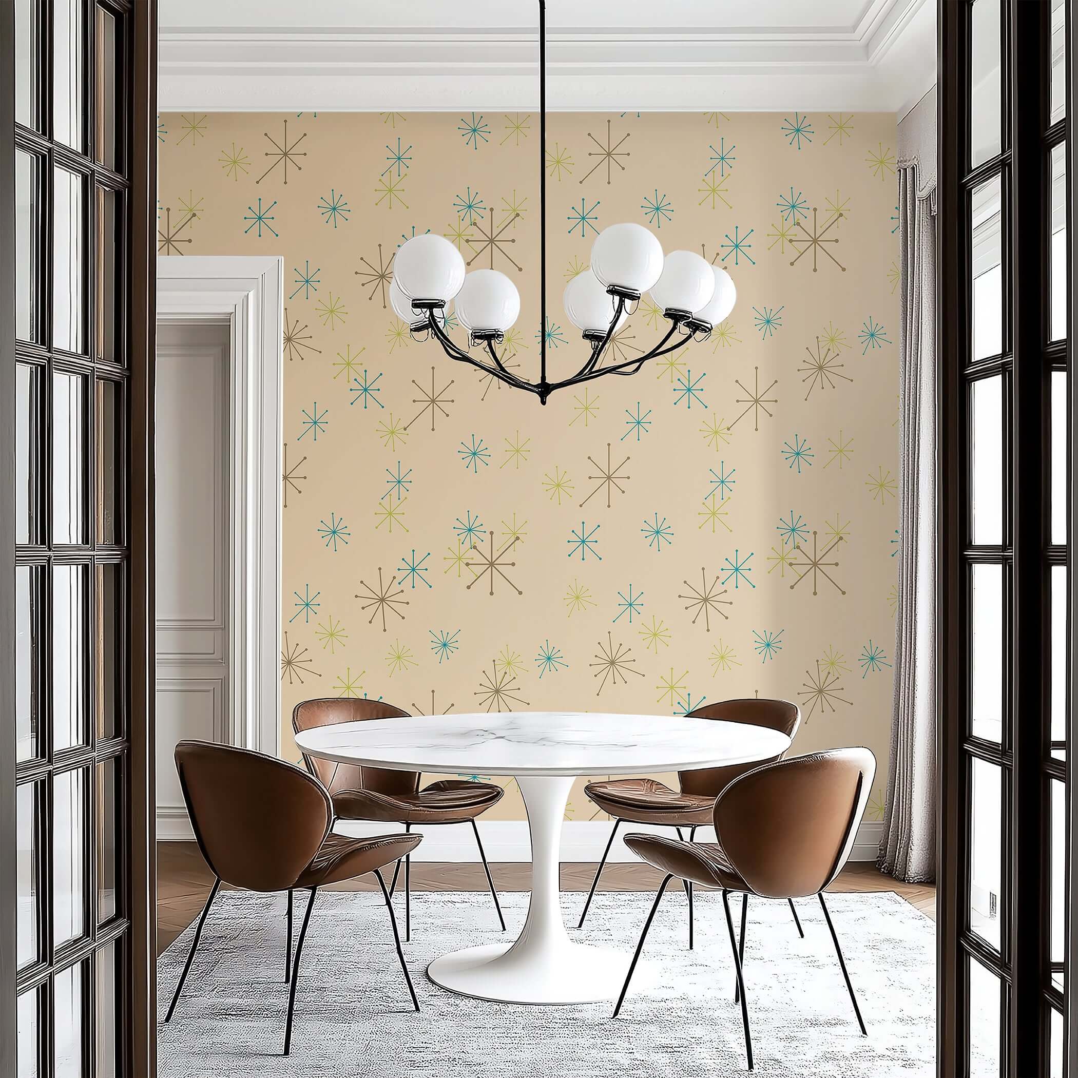 Modern dining room with Atomic Burst Fiesta mid-century wallpaper featuring teal, lime, and mocha starbursts on beige background.