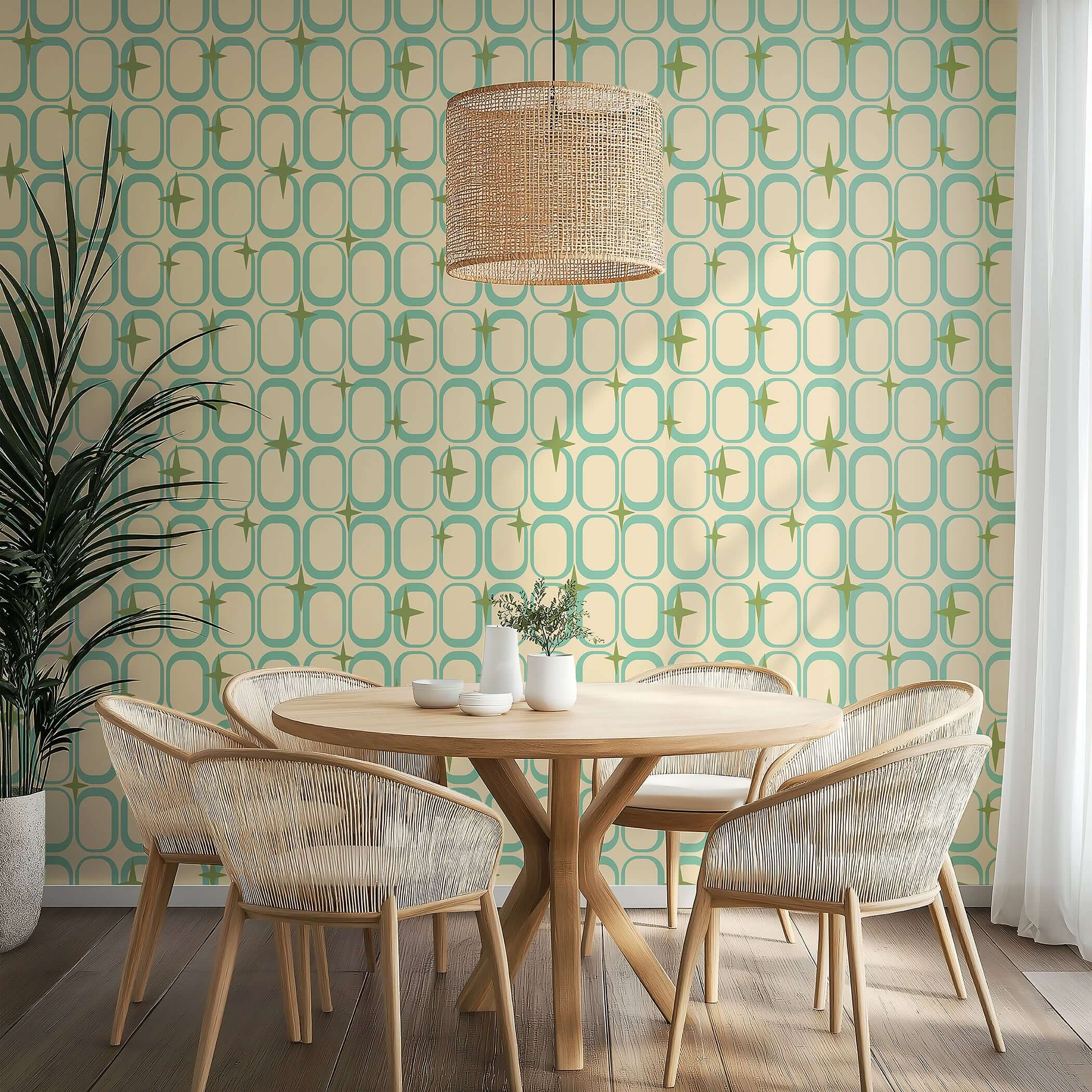Mid-century-modern Retro Orbit Sparkle wallpaper, featuring teal geometric ovals and olive starbursts, accent wall in dining area.