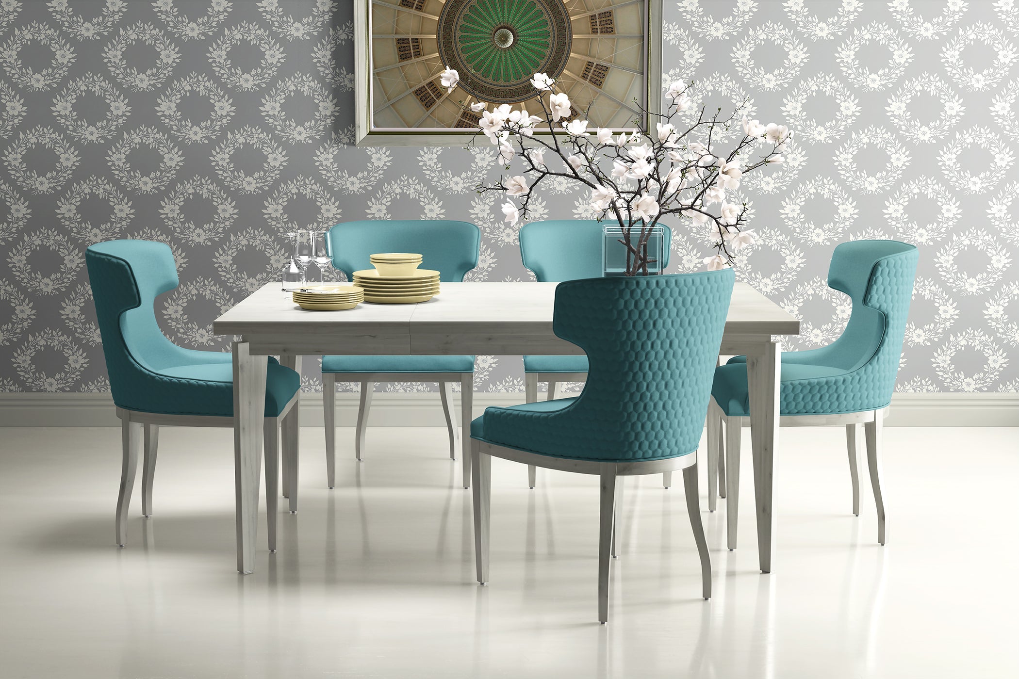 Dining room with teal chairs and white table against chic laurel wreath floral wallpaper in a traditional style.