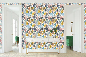 Vibrant bohemian wallpaper with tropical leaves in teal, coral, mustard, and navy, perfect for coastal accent walls.
