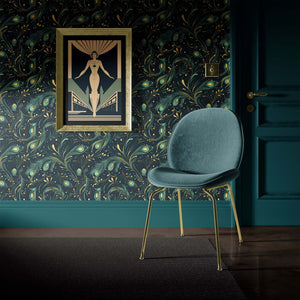 Art deco room with Celestial Peacock wallpaper featuring teal and gold peacock feathers, modern chair, and vintage artwork.